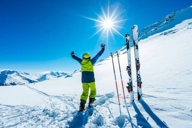 istock Young skier with hands in the air 643750610