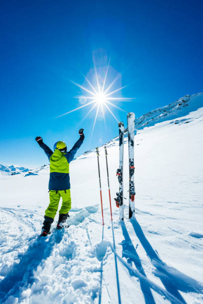 istock Young skier with hands in the air 643750614