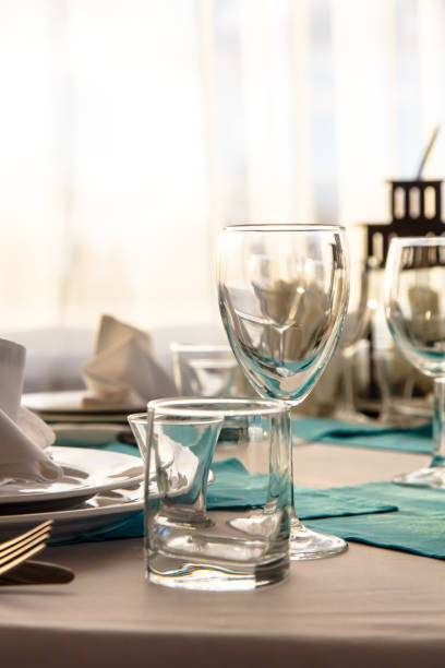 istock Linen napkin on a plate on the table covered with a white tablecloth. 643753730