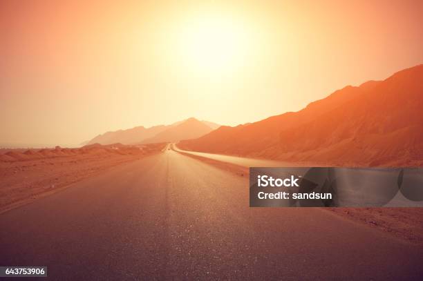 Highway At Sunrise Stock Photo - Download Image Now - Road, Desert Area, Sunrise - Dawn