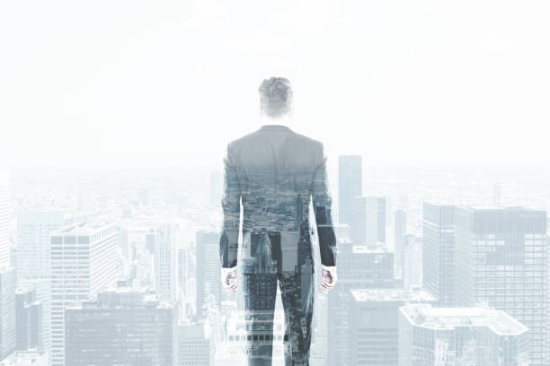 istock businessman in a suit looking at a cityscape. 643756972