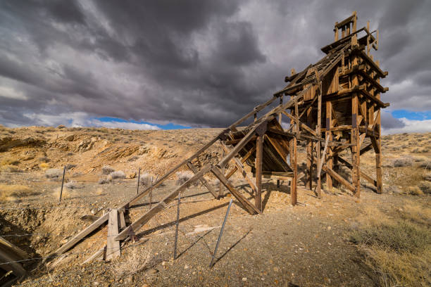 istock Old gold mining sluice life head frame in the Nevada desert. 643760316