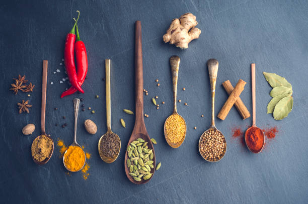 istock Variety of herbs and spices on slate background. 643760612