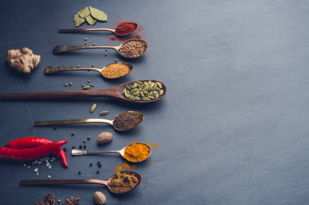 istock Variety of herbs and spices on slate background. 643760618