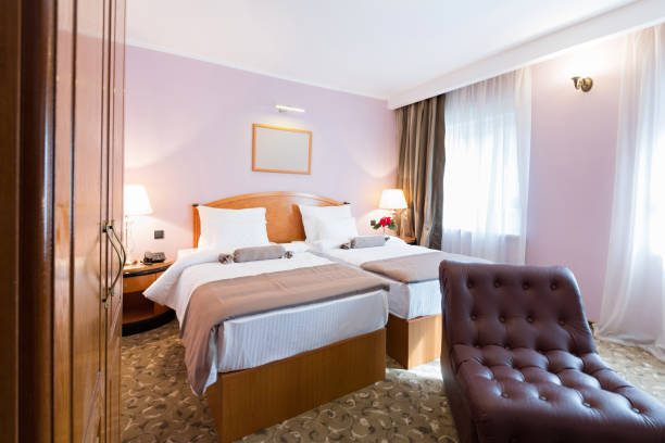 istock Interior of a new hotel double bed bedroom 643761190