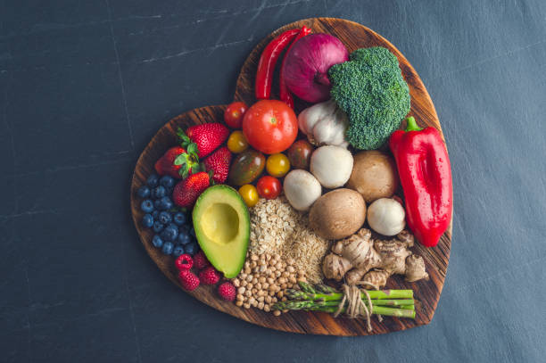 istock Healthy food on a heart shape cutting board. 643764520