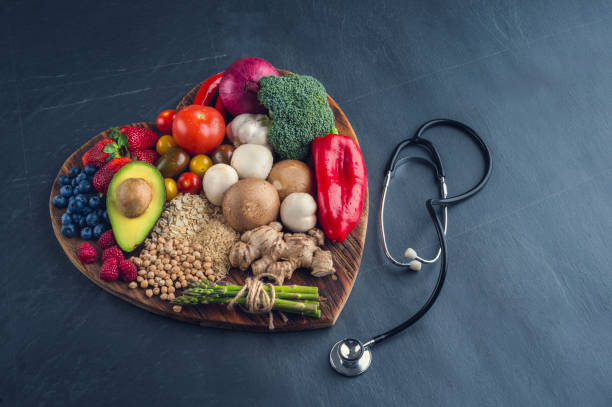 istock Healthy food on a heart shape cutting board. 643764522