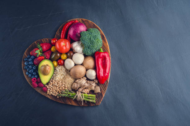 istock Healthy food on a heart shape cutting board. 643764528