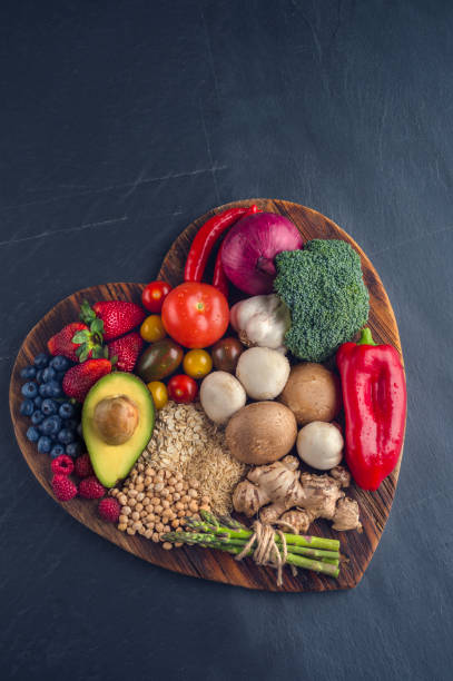 istock Healthy food on a heart shape cutting board. 643764534