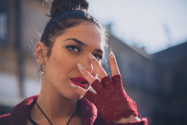 istock Serious sexy woman covers her face with hands 643764568