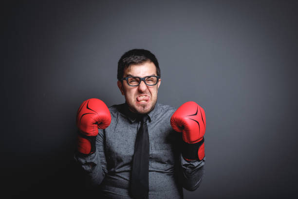 istock Power of funny businessman on blackboard 643768114