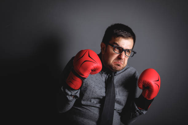 istock Power of funny businessman on blackboard 643768340