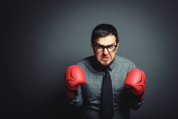 istock Power of funny businessman on blackboard 643768526