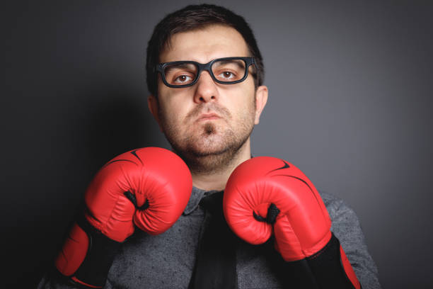 istock Power of funny businessman on blackboard 643768964