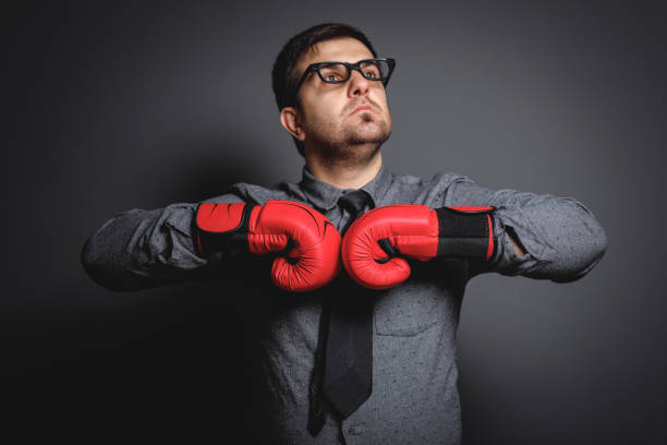 istock Power of funny businessman on blackboard 643775638
