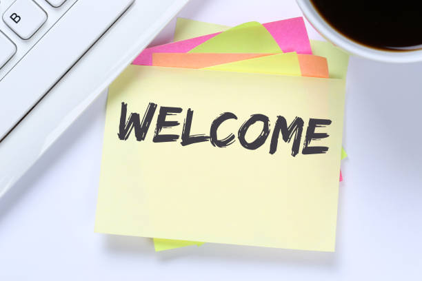 istock Welcome new employee colleague refugees refugee immigrants computer desk 643778324