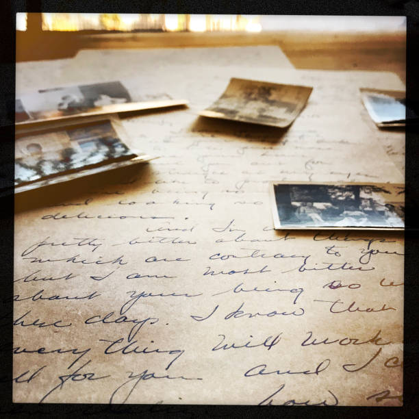 Old photographs arranged on love letters.  Black speckled border.  iPhone