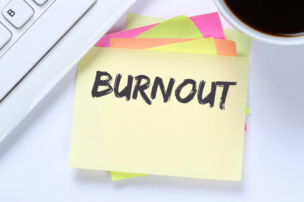 istock Burnout ill illness stress stressed at work business desk 643782100