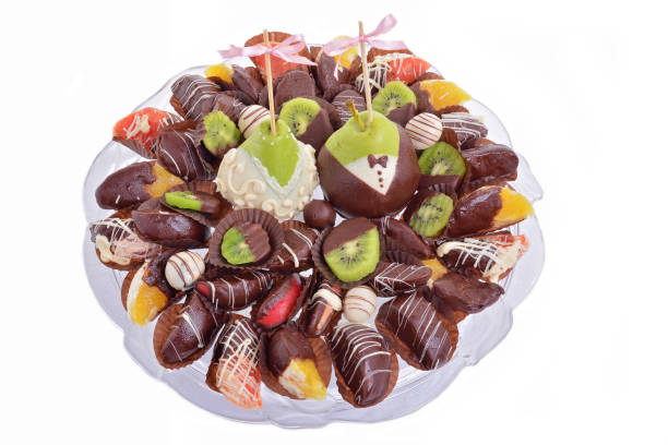 Chocolate-coated fruit on a plate