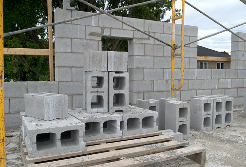 View of a cinder block masonry wall under constuction duing the building of a new residential apartment building