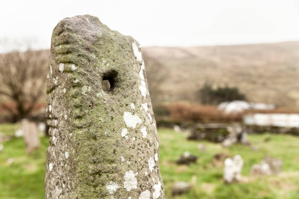 ogham stone in a graveyard - thumb stones imagens e fotografias de stock