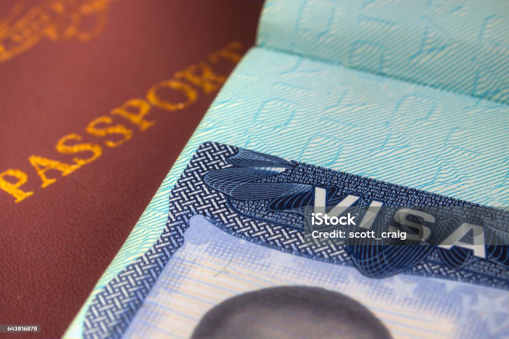 Passport and US Visa for Immigration This Image was taken of a Passport and US Visa for Immigration purpose . Emigration and Immigration Stock Photo