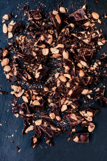istock Crushed chocolate on a black background / dark chocolate/ top view 643839360