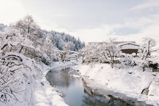 istock River surrounded with snow at Takayama 643842746