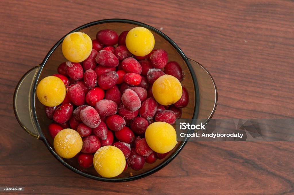 dish with frozen cherry plum and dogwood dish with frozen cherry plum and dogwood on table Autumn Stock Photo