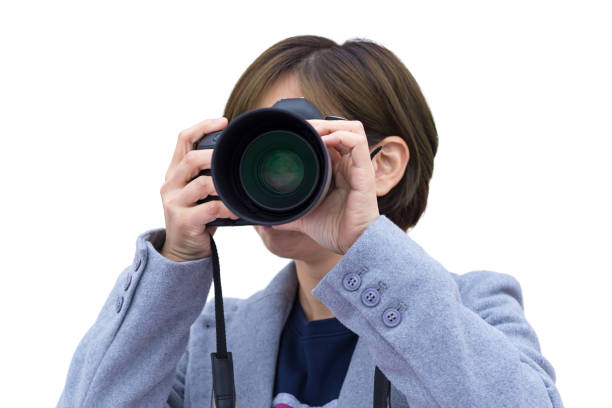 istock Woman with digital camera on the white background 643843890