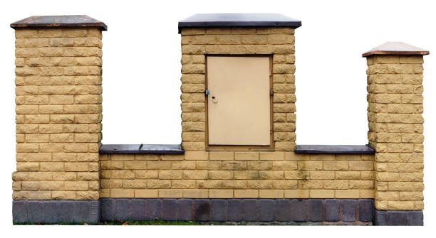 istock Fragment of an unfinished fence from rough yellow bricks. Isolated with patch 643844344