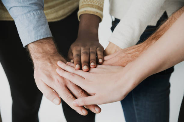 istock Pile of hands unity teamwork diverse people 643847956