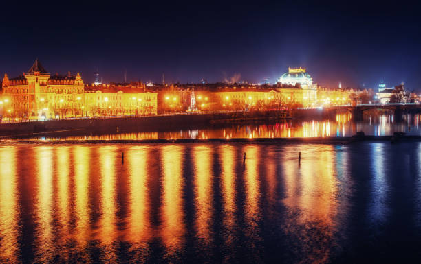 istock Reflection of Prague caste and the Charles bridge at dusk. 643860666
