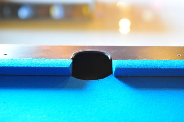 istock Background of blue woolen fabric flannel felt snooker table and hole 643868054