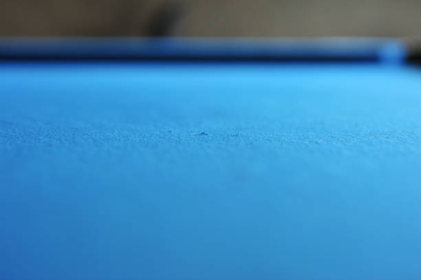 istock Background of blue woolen fabric flannel felt snooker table and hole 643868062