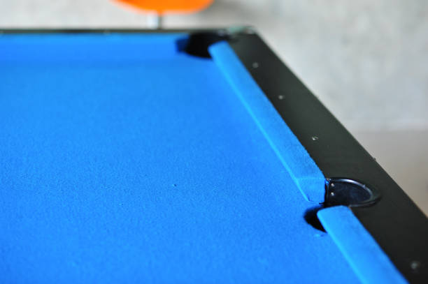 istock Background of blue woolen fabric flannel felt snooker table and hole 643868092