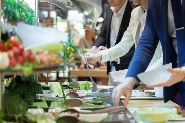 Lunch time Business people choosing from salad bar buffet stock pictures, royalty-free photos & images