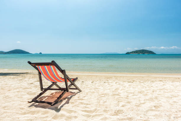 istock Beach chairs on the white sand beach 643874892