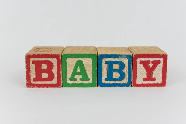 Baby Spelled in Blocks on a White Background stock photo