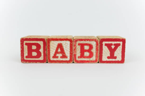 Baby Spelled in Blocks on a White Background stock photo