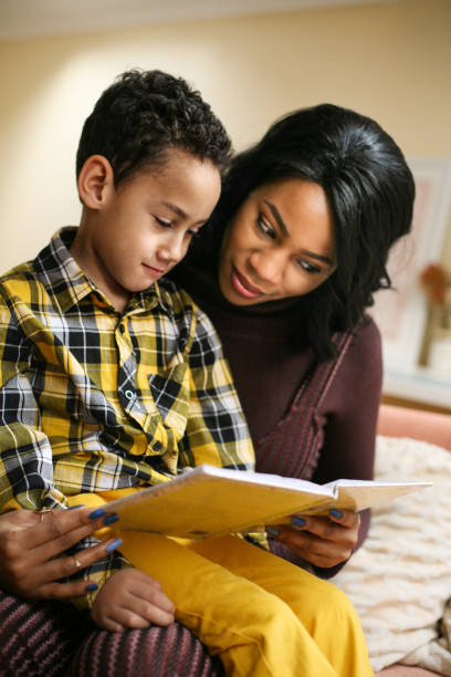 istock Young African American woman with her son. 643875206