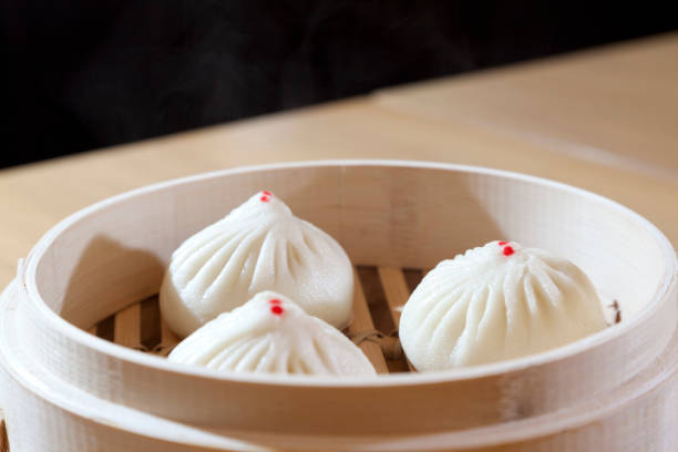 istock Steamed pork buns in basket 643878422