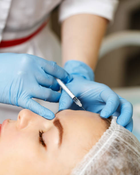 istock Subcutaneous injection in upper part of face. 643878474