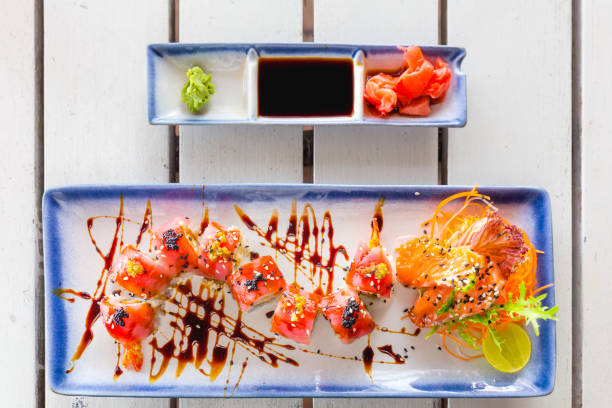 istock Delicious salmon sushi roll slices from above 643878656