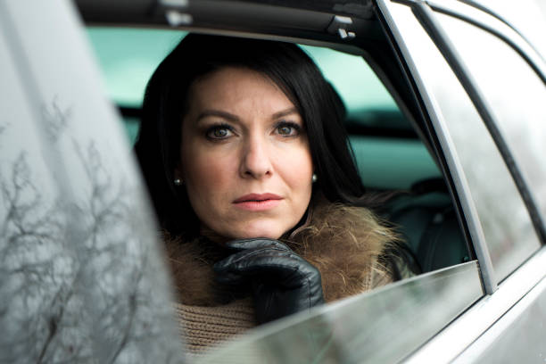 istock Woman sitting in a car 643879028