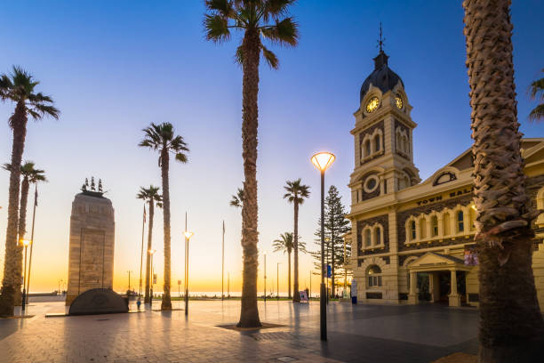 Adelaide, Australia - August 22, 2015: Moseley Square with Pioneer Memorial in the middle at night. Moseley Square is a public square in the City of Holdfast Bay at Glenelg.
