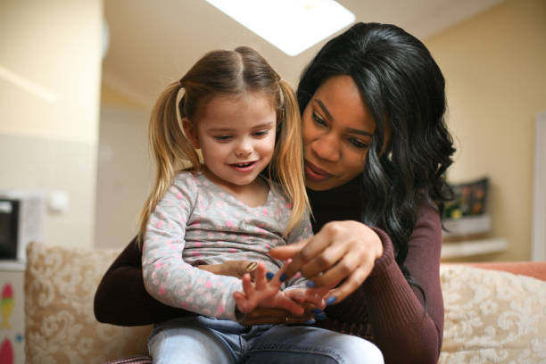 istock African American woman with child. 643879356