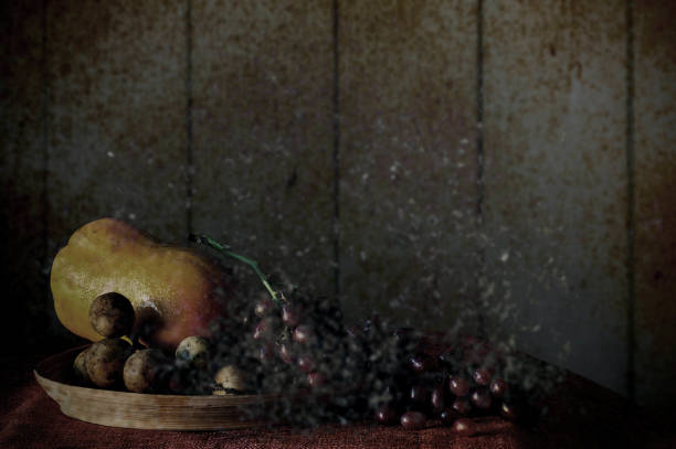 Art of fruit on the dining table with darkness.