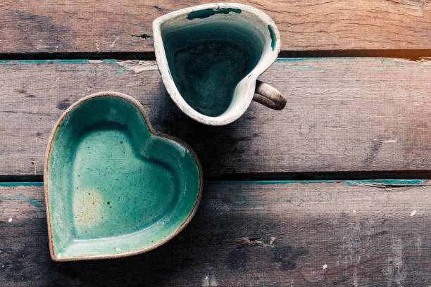 istock Saucer and cup on wooden floor. 643882586
