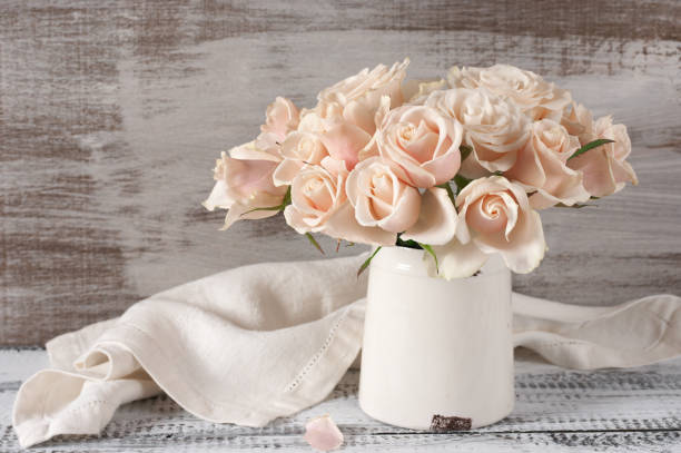 istock Pink roses in vintage vase 643886210